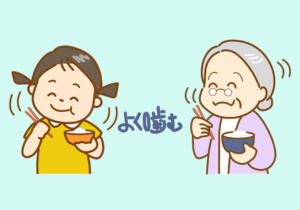 よく噛んで食べている少女とおばあちゃん
